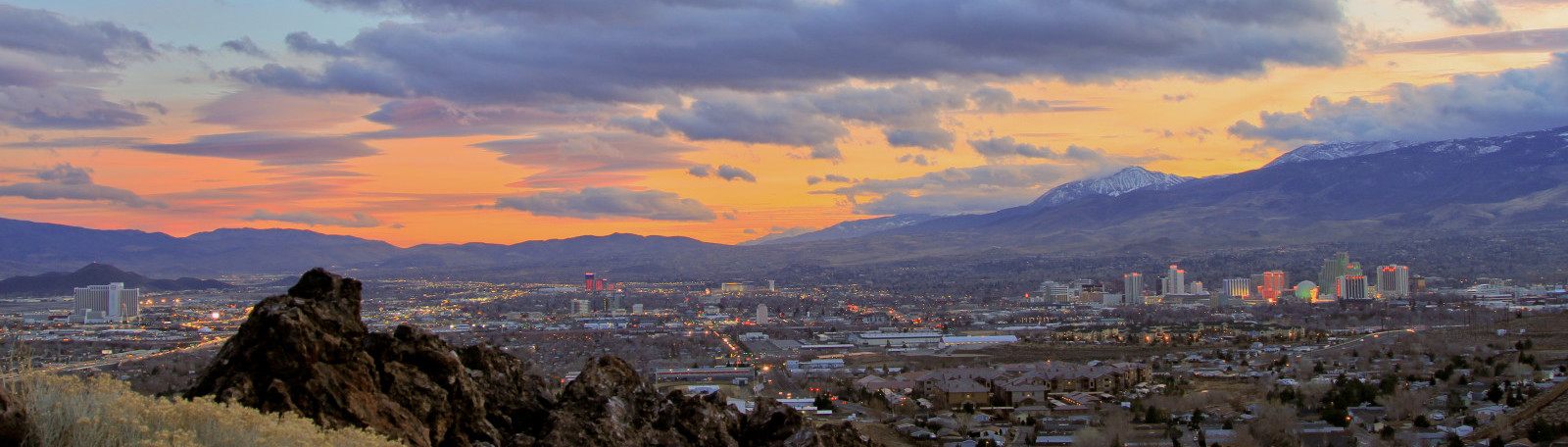 Reno, Nevada skyline at sunset with the Sierra Nevada mountains